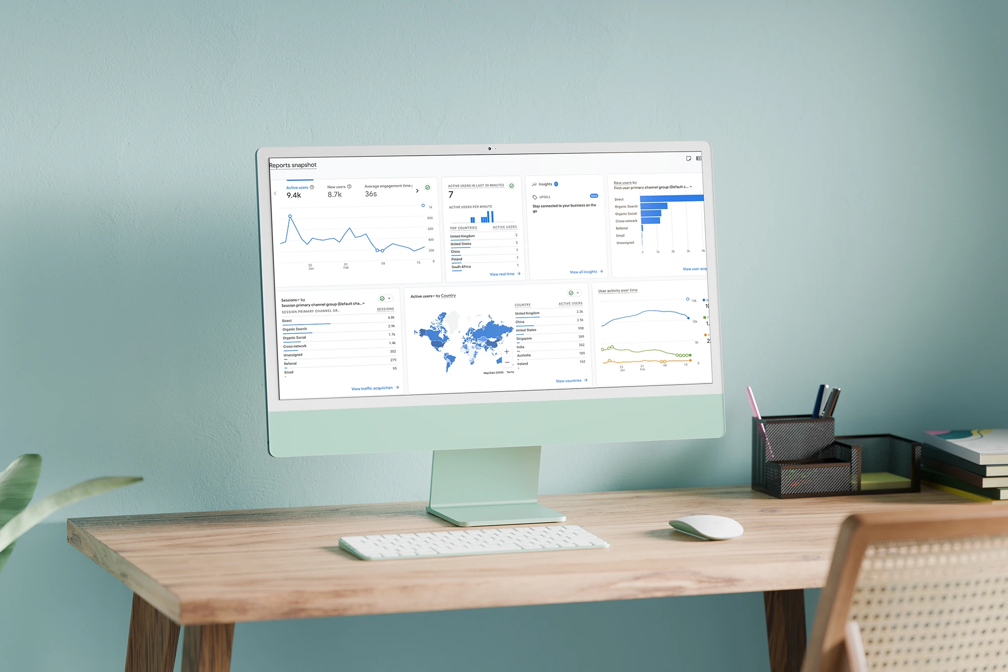 Modern computer monitor displaying data analytics on a wooden desk in a home office.