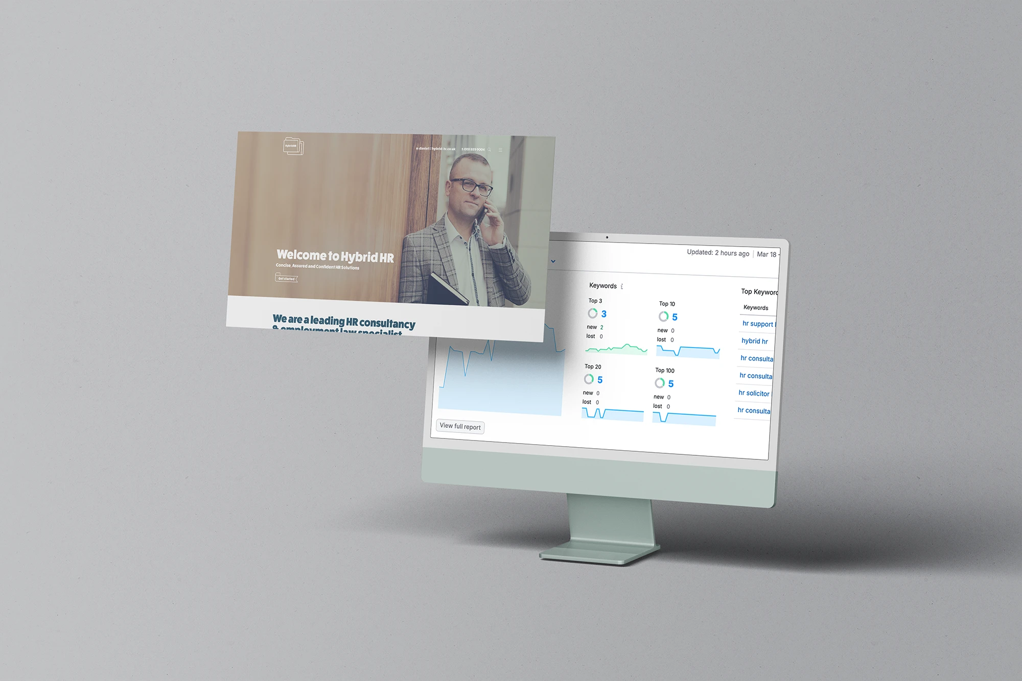 Business professional using HR software on a desktop computer in an office setting.